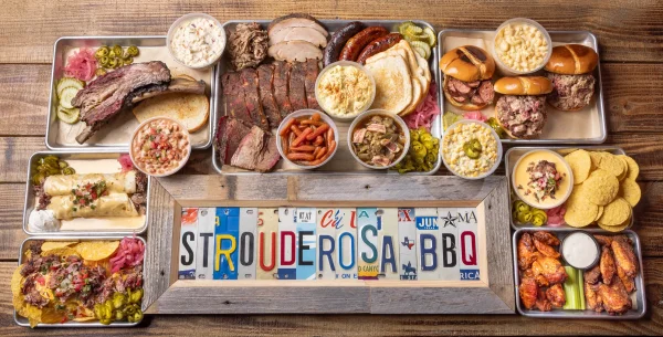 Strouderosa BBQ menu spread with smoked meats, sandwiches, wings, nachos and homestyle sides